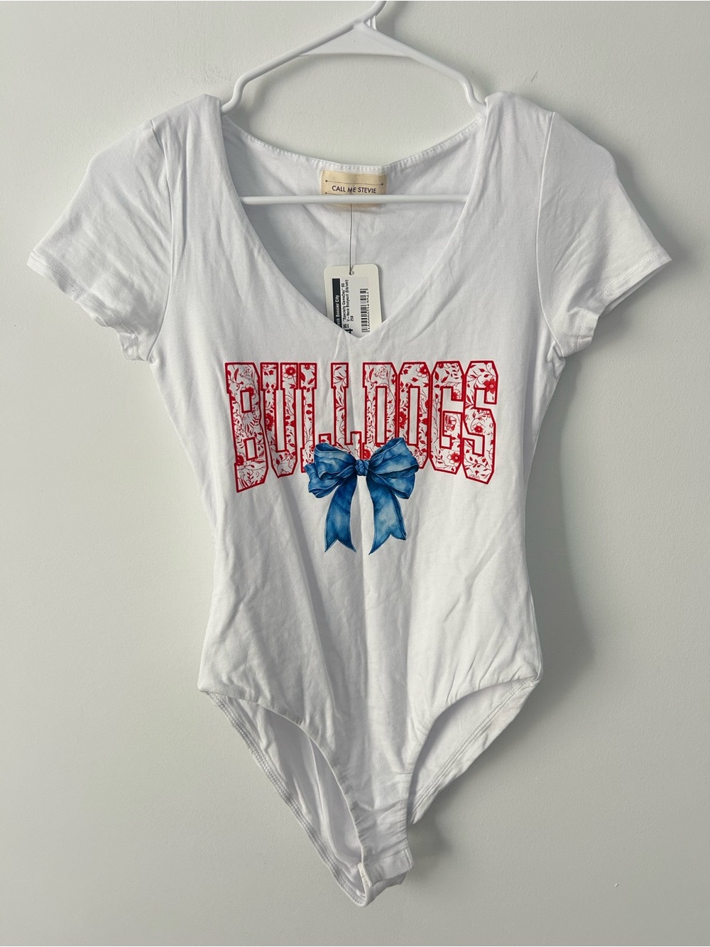 Krush White Bulldogs Graphic V-Neck Bodysuit with Blue Bow